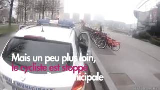 Un cycliste manque de se faire renverser par une voiture et se fait alpaguer par la police [upl. by Lydnek]