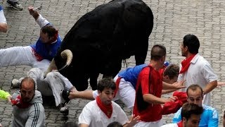 Two Gored in Spains Pamplona Bull Run [upl. by Reehsab]