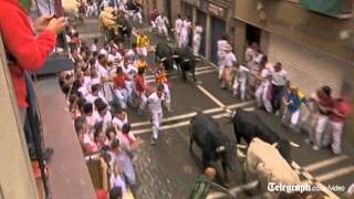 Running of the bulls in Spains Pamplona begins [upl. by Annaiviv]