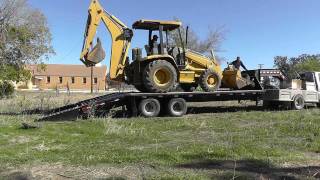 How To Load A Backhoe [upl. by Enomad]